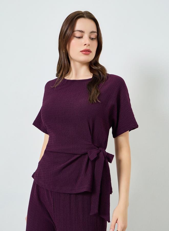 ستايلي طقم من بلوزة بارزة الملمس وبنطال بأرجل واسعة - Image 1